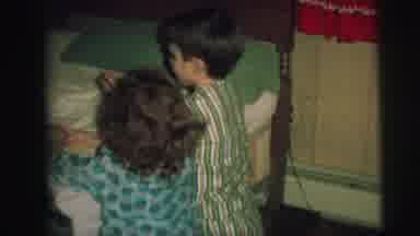 Lynbrook New York (1973): Kids Wearing Green Pajamas Kneel Beside Bed For Prayers