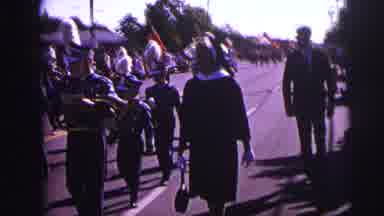 Lynbrook New York (1973): A Nun And A Man In A Suit And Tie Walk Down A Street