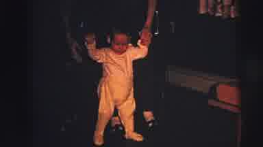 Lynbrook New York (1973): Baby Being Held In A Standing Position By Arms
