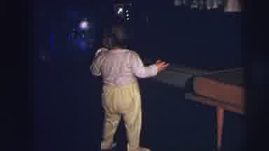 Lynbrook New York (1973): A Child Walks By And Slowly Leans Over To The Table