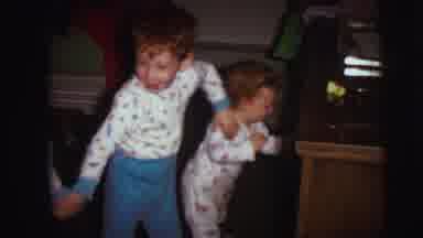 Lynbrook New York (1973): Three Kids Wearing White Pajamas Hold Hands Next To