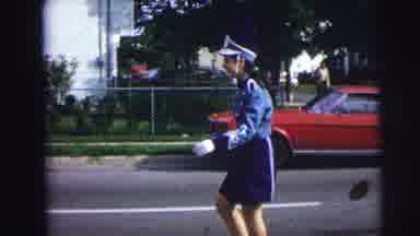 Lynbrook New York (1973): Girl Color Guard Leading A High School Band In A Parade
