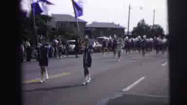 LYNBROOK NEW YORK-1973: Girls Twirl Batons In Marching Band Parade