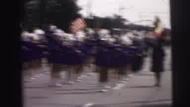 Lynbrook New York (1973): A Marching Band With Majorettes Twirling Batons On A