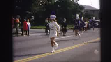 LYNBROOK NEW YORK-1973: Women Expertly Twirl Batons And March Together In The
