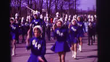 Lynbrook New York (1973): Baton Twirlers And School Marching Band Marching In A