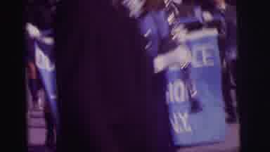 Lynbrook New York (1973): People Holding Blue And White Parade On A Bright Sunny