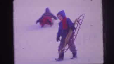 Lynbrook New York (1973): A Boy Walking Up A Snowy Hill While Carrying His Sled