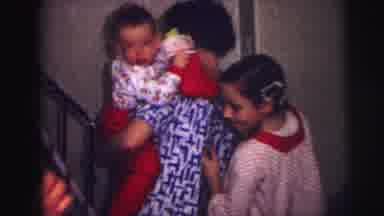 Lynbrook New York (1973): Girl Wearing Red Pajamas And Hair Curlers Hangs