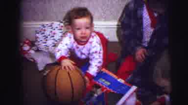 Lynbrook New York (1973): Boys Open Christmas Presents While Sitting On The Floor