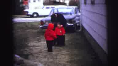 Lynbrook New York (1973): Children Play Outside The Home Accompanied By A Guardian