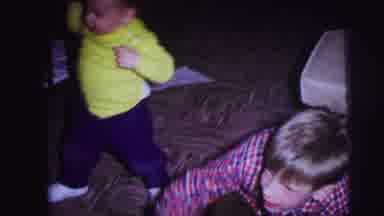 Lynbrook New York (1973): Baby Wearing Green Shirt Walks To Kids Wrestling On