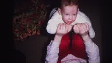 Lynbrook New York (1973): A Child Is Happily Playing With Another Person