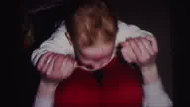 Lynbrook New York (1973): Woman Wearing Red Pants Rocks Baby On Knees On Brown