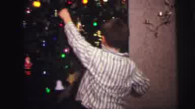 Lynbrook New York (1973): Youthful Boy Placing A Blue Ornament On A Christmas Tree