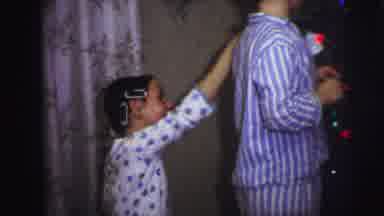 LYNBROOK NEW YORK-1973: Children Decorate Christmas Tree With Ornaments