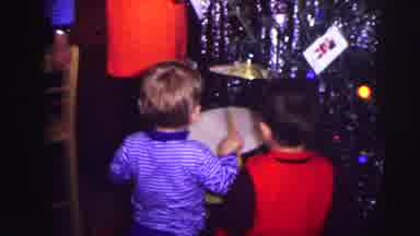 Lynbrook New York (1973): Little Boy Playing On A Small Drum Set In Front Of A