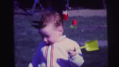 Lynbrook New York-1973: Toddler Playing Outside With Shovel And Pails