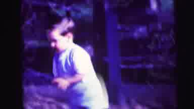 Lynbrook New York-1973: Young Boy In Shorts Walking On Dirt Patch
