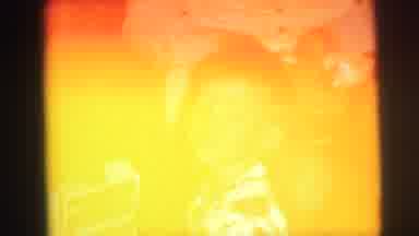 Lynbrook New York (1973): Boy Sitting Next To Person On Floor Smiles For Camera