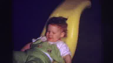 Lynbrook New York (1973): The Child Is Sitting In Racker And Play