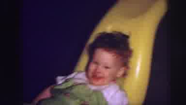 Lynbrook New York (1973): The Little Kid Who Is Having Fun On His Yellow Sled