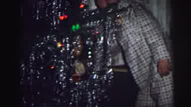 Lynbrook New York (1973): Two Children Walking Fast Towards Christmas Tree To Put