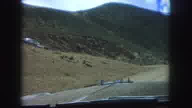 Colorado Springs USA (1958): Two Vehicles Driving Down The Dirt Road Coming
