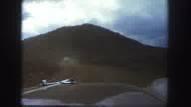 Colorado Springs USA (1958): A Hood Of A Car As It Zooms Down A Road