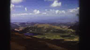 Colorado Springs USA (1958): At Edge Of Road Looking Down Lake Surrounded By Green