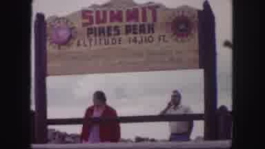 Colorado Springs USA (1958): View Of Yellow Pikes Peak Summit Sign And People
