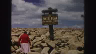 Colorado Springs USA (1958): Woman Wearing Red Sweater Walks Toward Pikes Peak