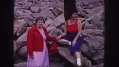 Colorado Springs USA (1958): Two Females Outside Sitting On Some Rocks Pointing At