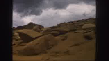 Colorado (1958): Changing Mountain Landscape With Winding Roads Under Cloudy Grey