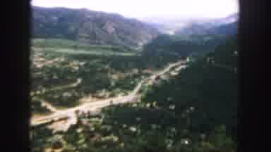 Colorado (1958): A View From Far Above Of A Vast Expanse Of Trees Road And A