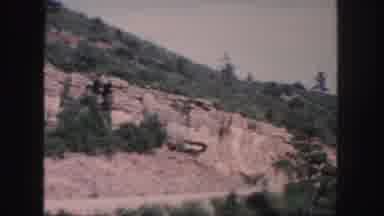 Colorado (1958): Landslide Covers Mountain Road With Trees Cloudy Sky No Vehicle