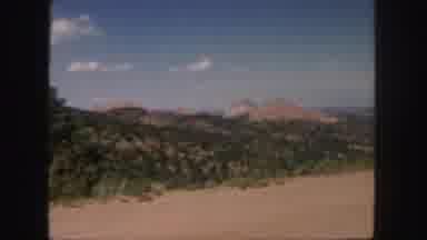 Colorado (1958): Cloud And Mountain Views From A Dirt Road With Blowing Dust