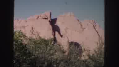 Colorado (1958): A Sunny Day Overlooking A Mountain Face Situated With Tall Shrubs
