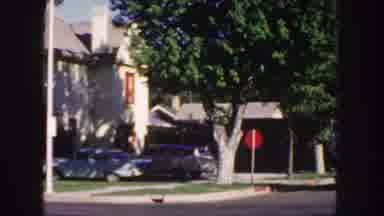 Colorado (1958): Vintage Car Driving Down Residential Neighborhood