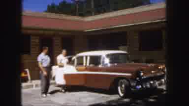 Colorado (1958): Man And Women Opening Car Door And Looking At Car