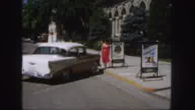 Colorado (1958): A Lady In A Red Dress Getting Into A Car On The Roadside Showing