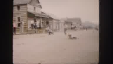 Colorado (1958): Two Men Dressed In Cowboy Attire Fake Fall Fall Down In An Old