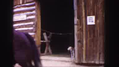Colorado (1958): Person On A Horse Passes By To Reveal A Barn Dog That Is Greeted