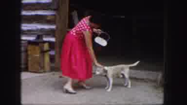 Colorado (1958): Woman Petting A Dog Outside