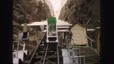 Colorado (1958): Vehicle Travelling Up A Mountain On Rails With Passengers Inside