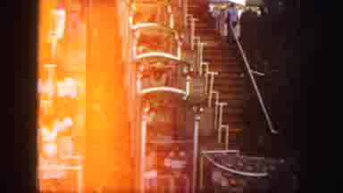 Colorado (1958): Stairs Next To A Descending Ride People Sitting In Others Waiting