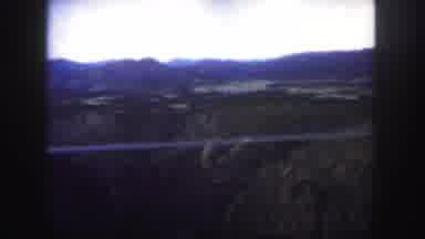 Colorado (1958): The Bridge Looks Small Compared To The Mountains And The Trees