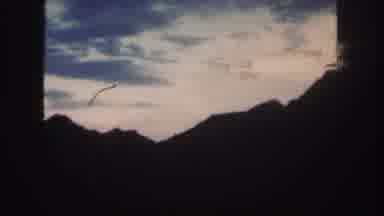 Colorado (1958): Beautiful View Of A Cloudy Sky With Mountains Below