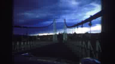 Colorado (1958): View Of Yellow Suspension Bridge On A Windy Cloudy Day