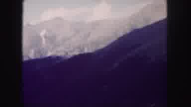 Colorado USA (1958): Man Takes A Cable Car Ride Through A Tourist Center In A